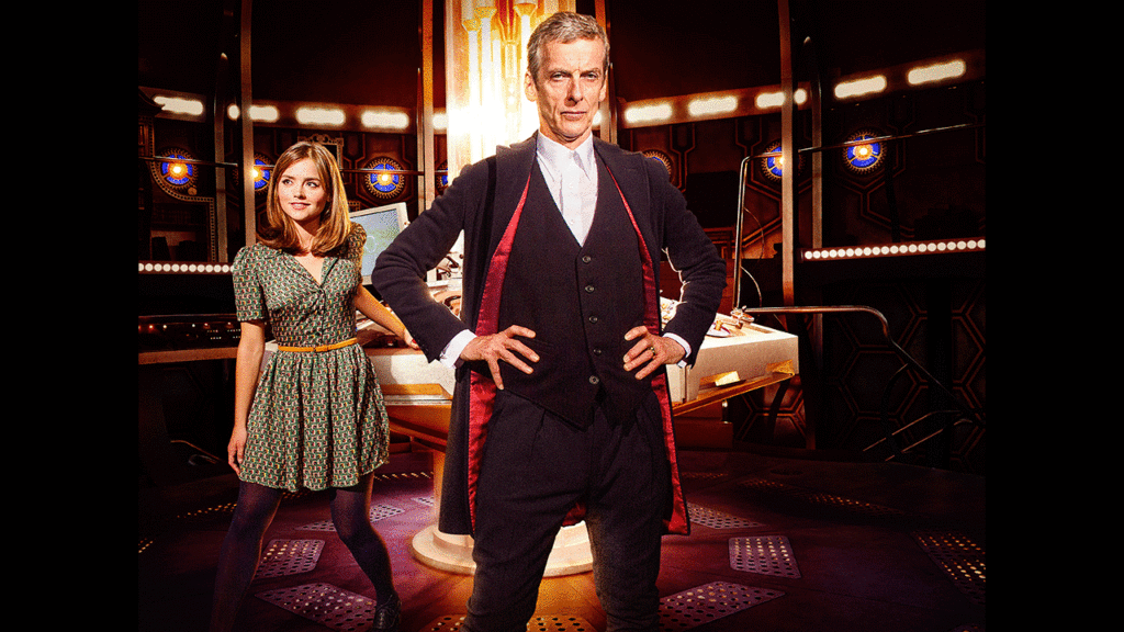 The Doctor standing heroically with Clara behind him in the TARDIS console room